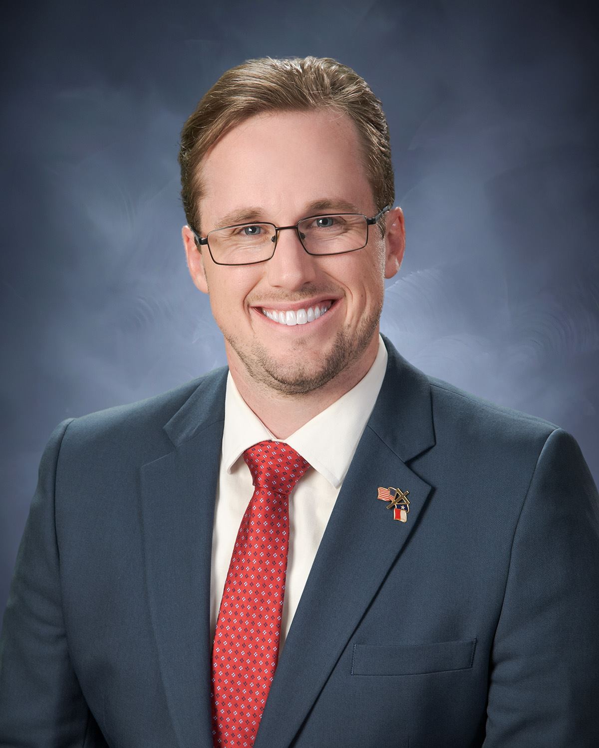 Photo of Dan Davis from the waist up.