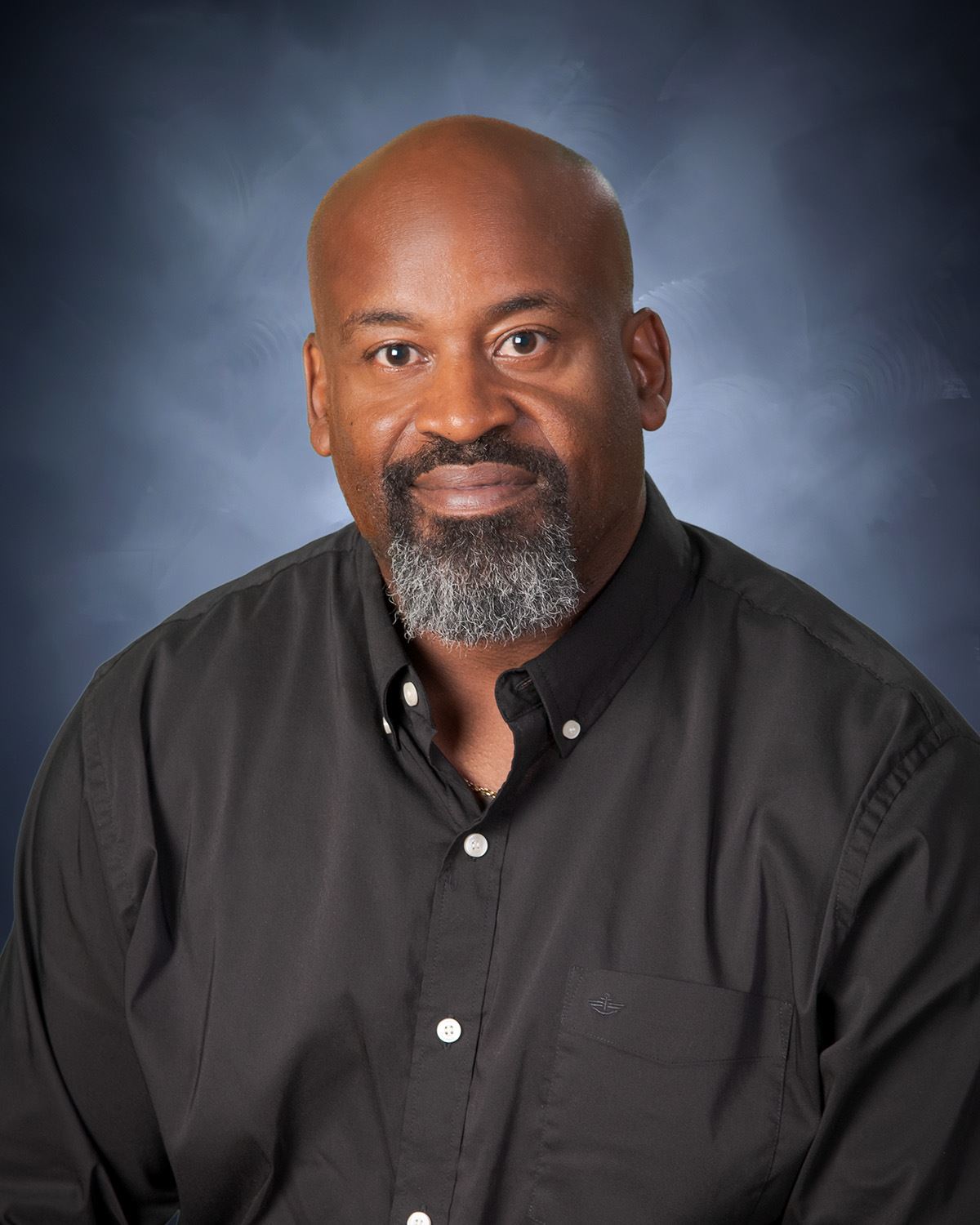 Headshot from the waist up of Robbie Hall.